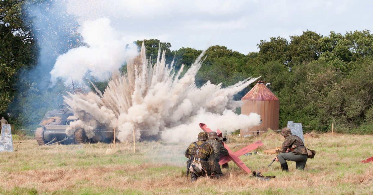 WW2 Reenactors take cover from incoming artillery